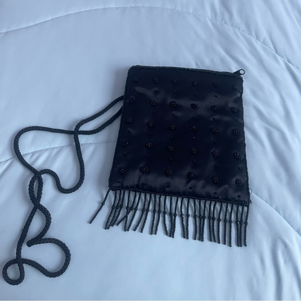 Satin beaded crossbody black purse.Zip closure. 6”x6”x1”  and 21” Handle